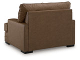 VillaCourt oversized chair close-up of caramel faux leather texture