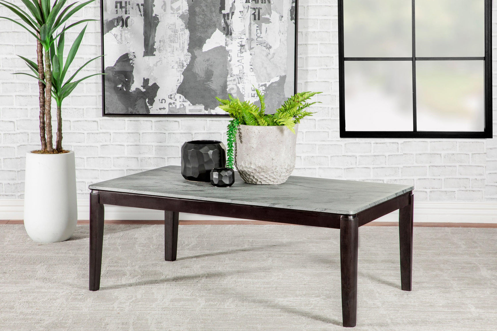 Mozzi coffee table with black legs and faux marble top side view