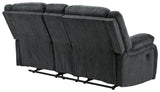 Rear view of Draycoll Slate Reclining Loveseat with bustle back