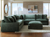 Close-up detail of jade velvet upholstery on sectional sofa