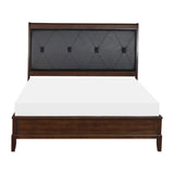 Cotterill king panel bed in dark cherry wood with black tufted faux leather headboard front view