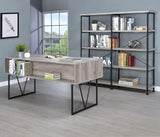 Side view of Analiese grey driftwood desk with black metal legs