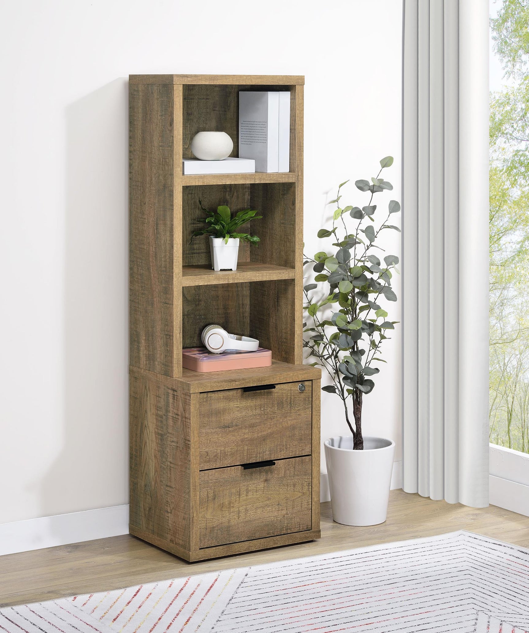 Bookcase close-up showing three shelves and lockable drawer