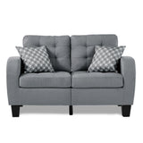 Sinclair Gray Loveseat front view showing tufted gray fabric and wood frame