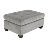 Side view of taupe microfiber tufted ottoman showing wood finish legs