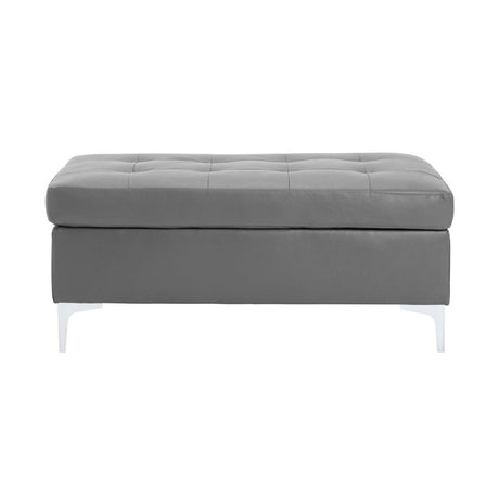 Barrington Gray Ottoman front angle showing tufted top and silver metal legs