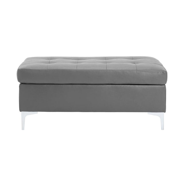 Barrington Gray Ottoman front angle showing tufted top and silver metal legs