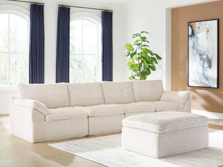 Side angle view of Fannin Ivory Sectional and Ottoman
