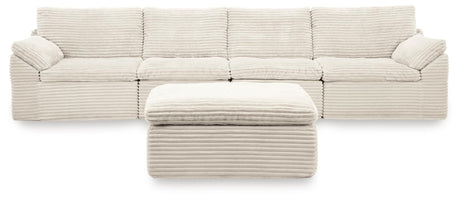 Side view of Fannin Ivory 4-Piece Sectional Sofa with Ottoman