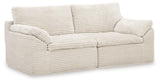 Close-up detail of ivory chenille fabric and cushioning