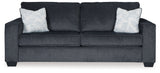 Altari Slate sofa and loveseat with floral pillows
