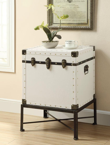 Front view of Nancy white accent cabinet with nailhead trim and metal legs