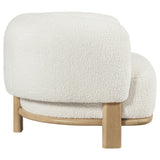 Neutral ivory boucle upholstered accent chair side view