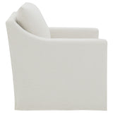 Overall chair silhouette in beige fabric