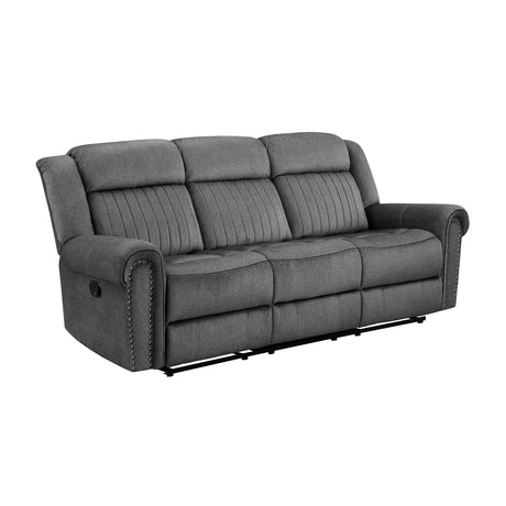 Side view of Brennen charcoal reclining sofa highlighting nailhead trim
