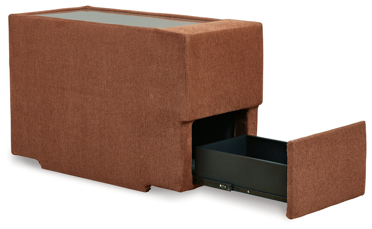 detail of audio system controls on sectional sofa