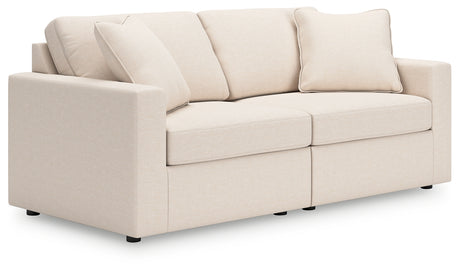 Angle side view of Modmax oyster loveseat