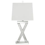 Close-up of Dominick table lamp's mirror tile base and acrylic finial