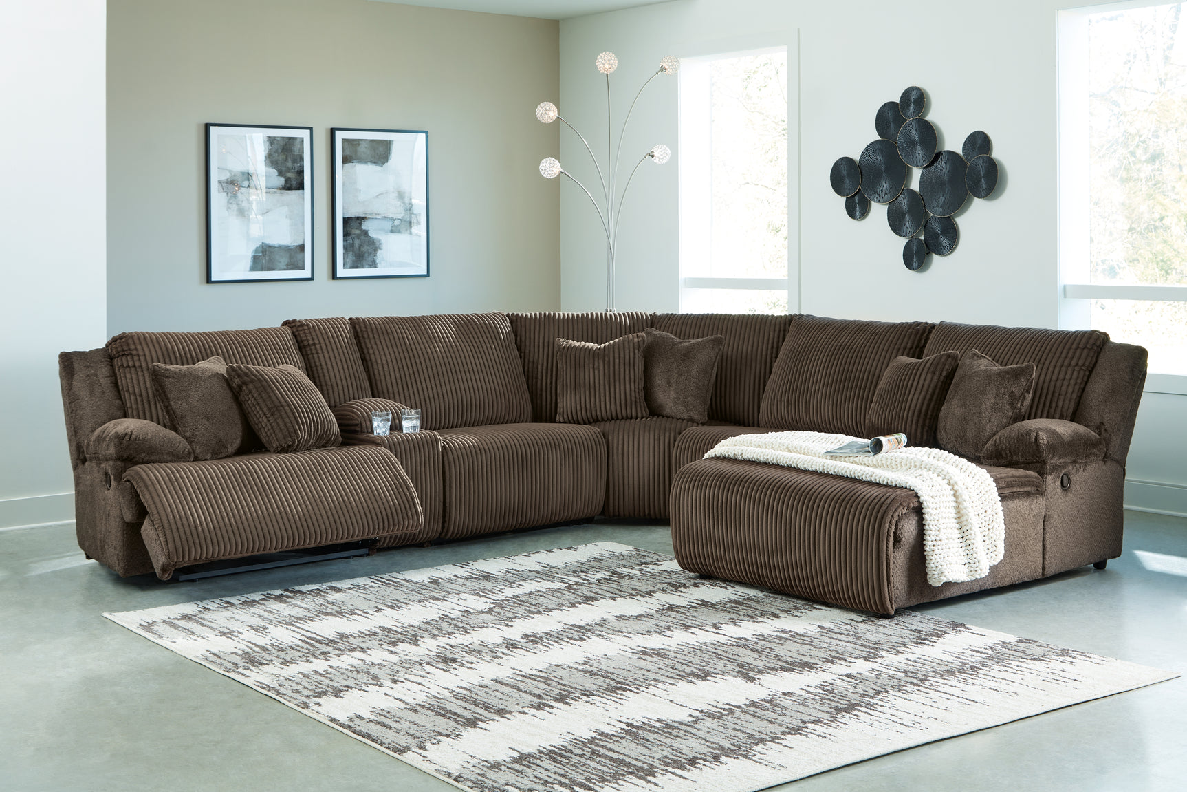 Top Tier chocolate velvet sectional showing attached cushions and accent pillows