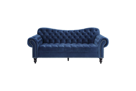 detail view of tufted navy velvet upholstery on sofa