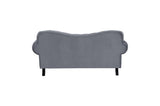 Back view of velvet tufted sofa