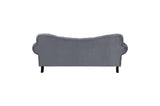 Side profile of velvet tufted loveseat