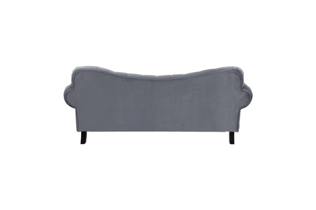 Side profile of velvet tufted loveseat