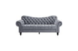 Close-up of velvet tufted sofa cushions