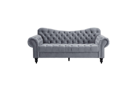 Close-up of velvet tufted sofa cushions