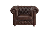 Close-up of sofa arm with tufted faux leather upholstery