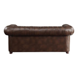 Detail of tufted brown faux leather upholstery on sofa