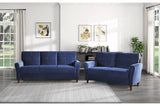 Side view of Dunleith blue velvet tufted sofa and loveseat set