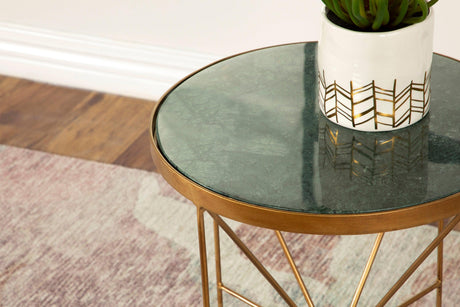 Side view of Eliska round accent table highlighting teardrop feet and marble surface