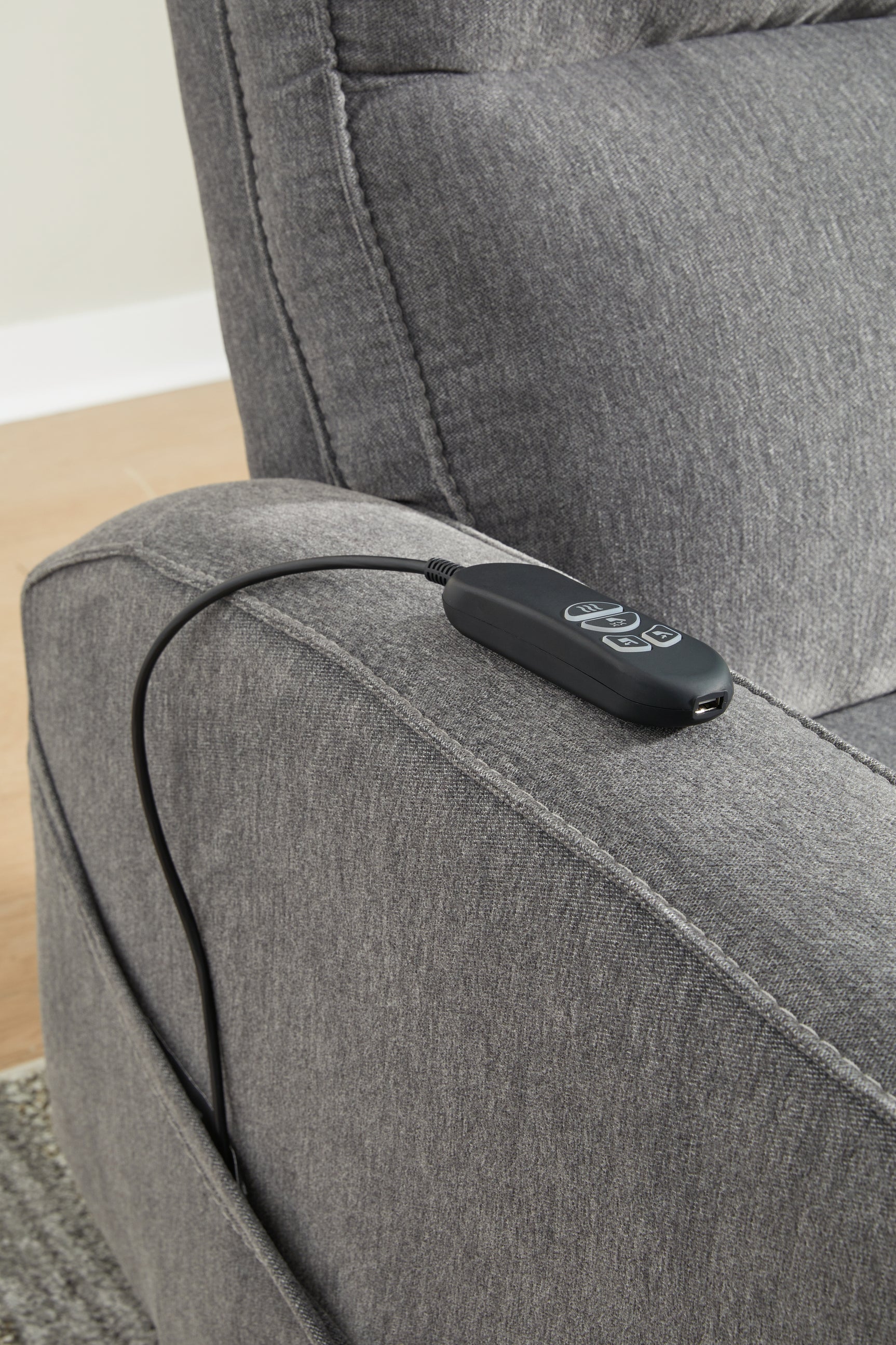 Detail of handheld remote control for recline and massage functions
