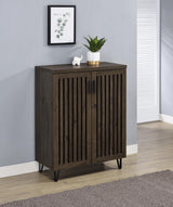Side angle of Brixton shoe cabinet showing vertical slatted doors and metal legs