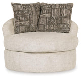 Head-on view of Soletren Stone Chenille Swivel Accent Chair featuring geometric throw pillows