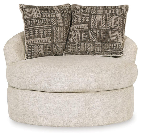 Head-on view of Soletren Stone Chenille Swivel Accent Chair featuring geometric throw pillows