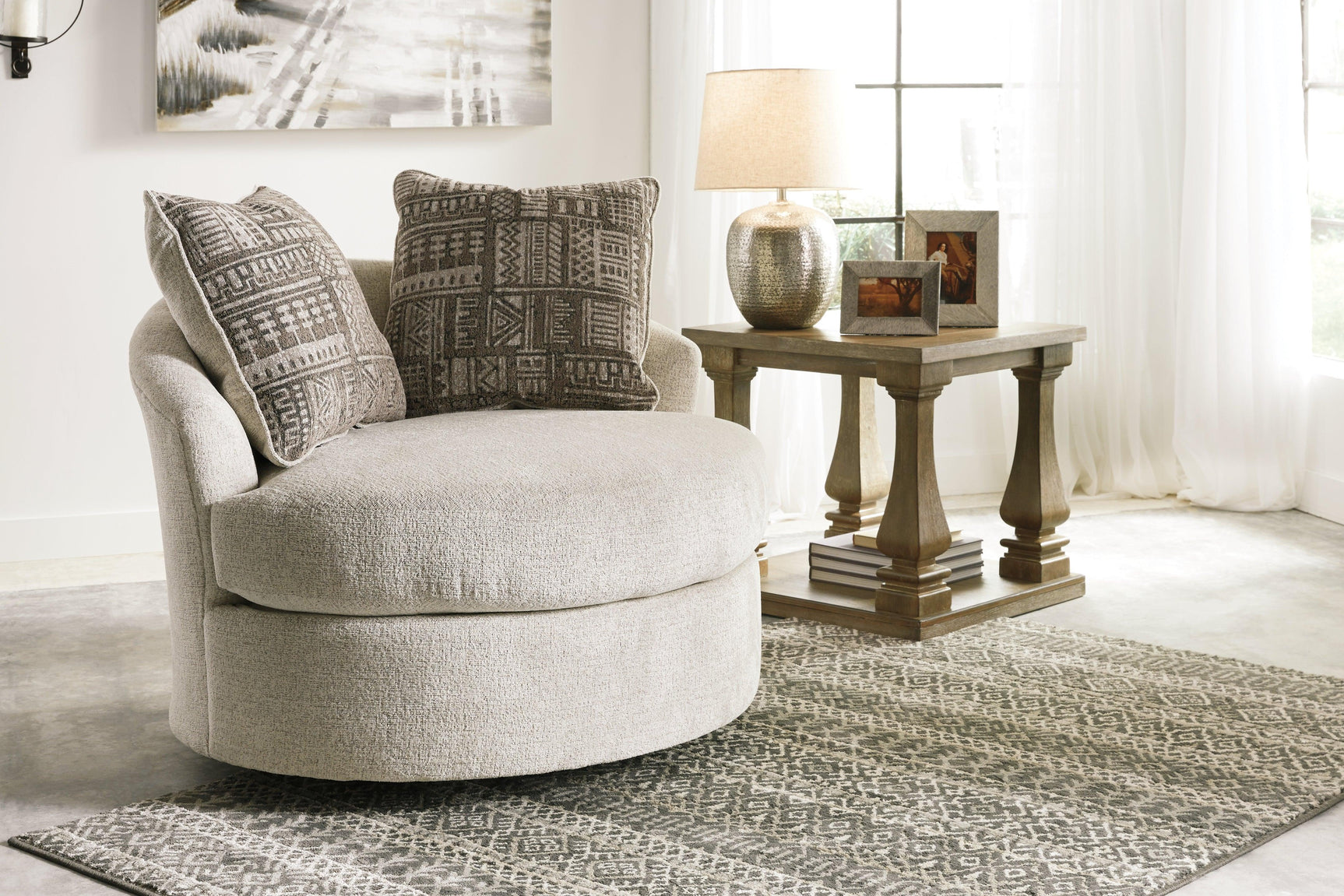 Soletren Stone Chenille Swivel Accent Chair showing exposed feet with faux wood finish