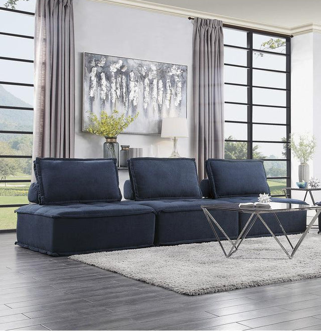 Ulrich blue tufted fabric sofa angled front view