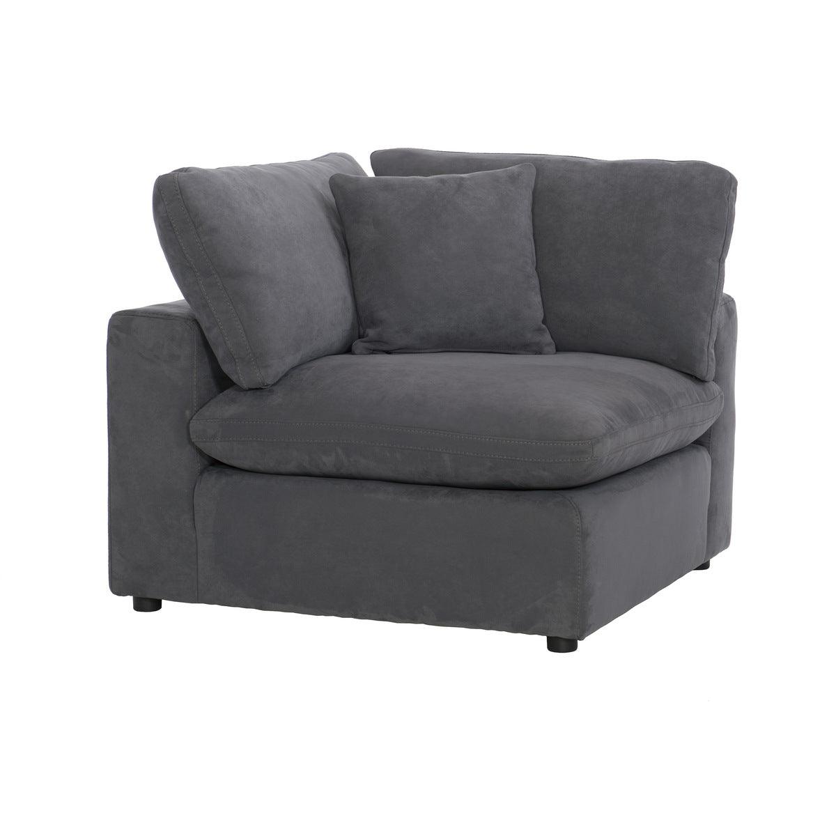 Angled view of gray love seat highlighting reversible cushions and wood frame