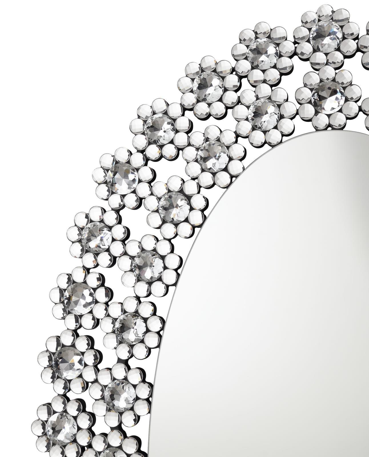 Decorative crystal flower details on mirror frame