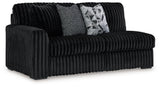 Living room setting with midnight velvet sectional
