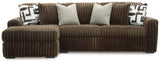 Detail of chocolate velvet upholstery on sectional sofa