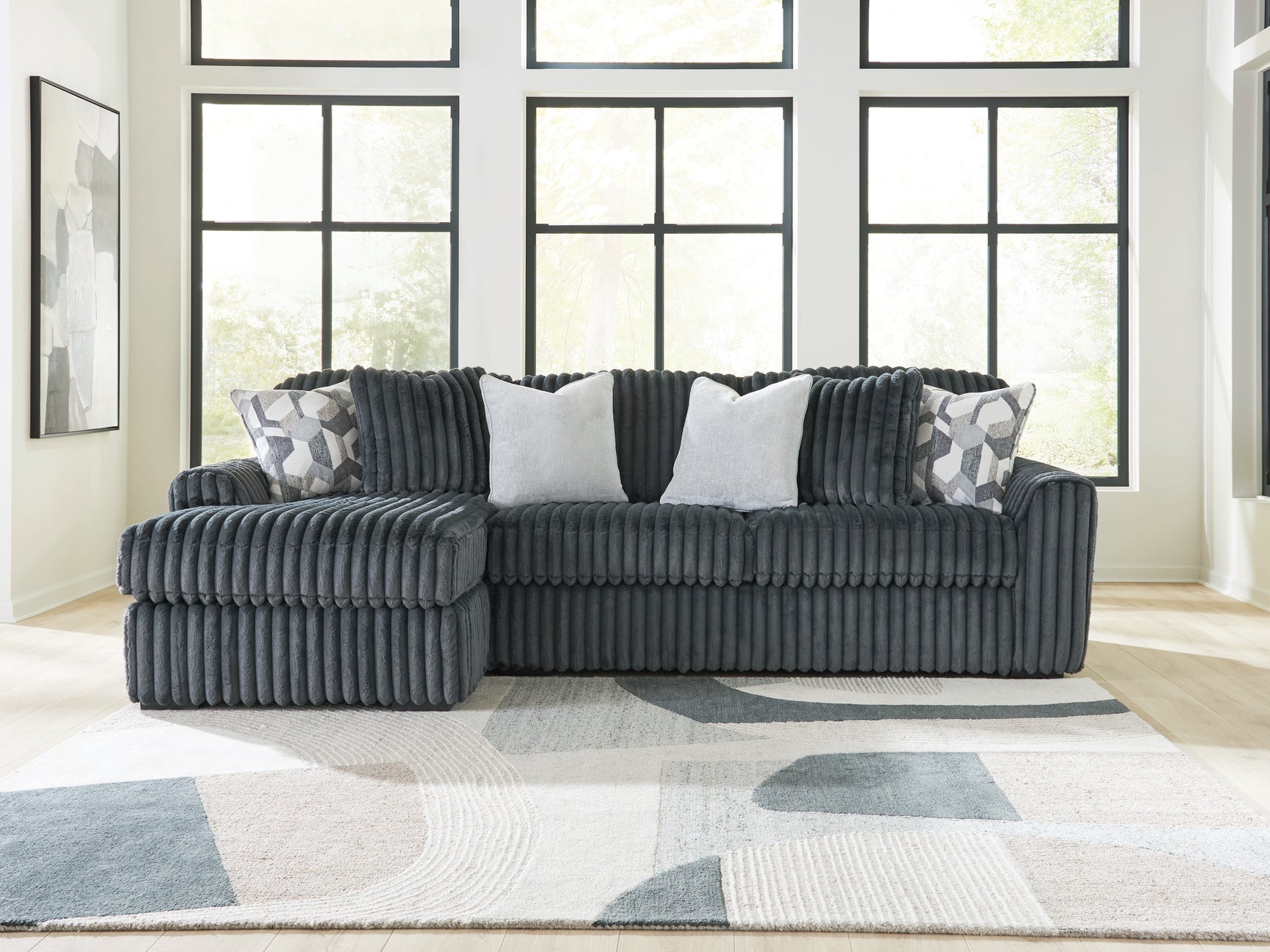Living room view of Midnight-Madness Gunmetal 2-Piece Sectional Sofa with chaise