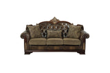 Close-up detail of tufted chenille fabric and faux leather upholstery