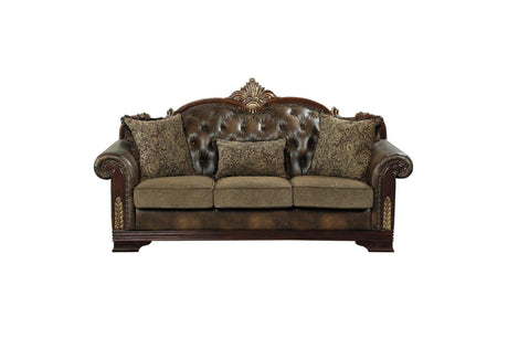 Close-up detail of tufted chenille fabric and faux leather upholstery