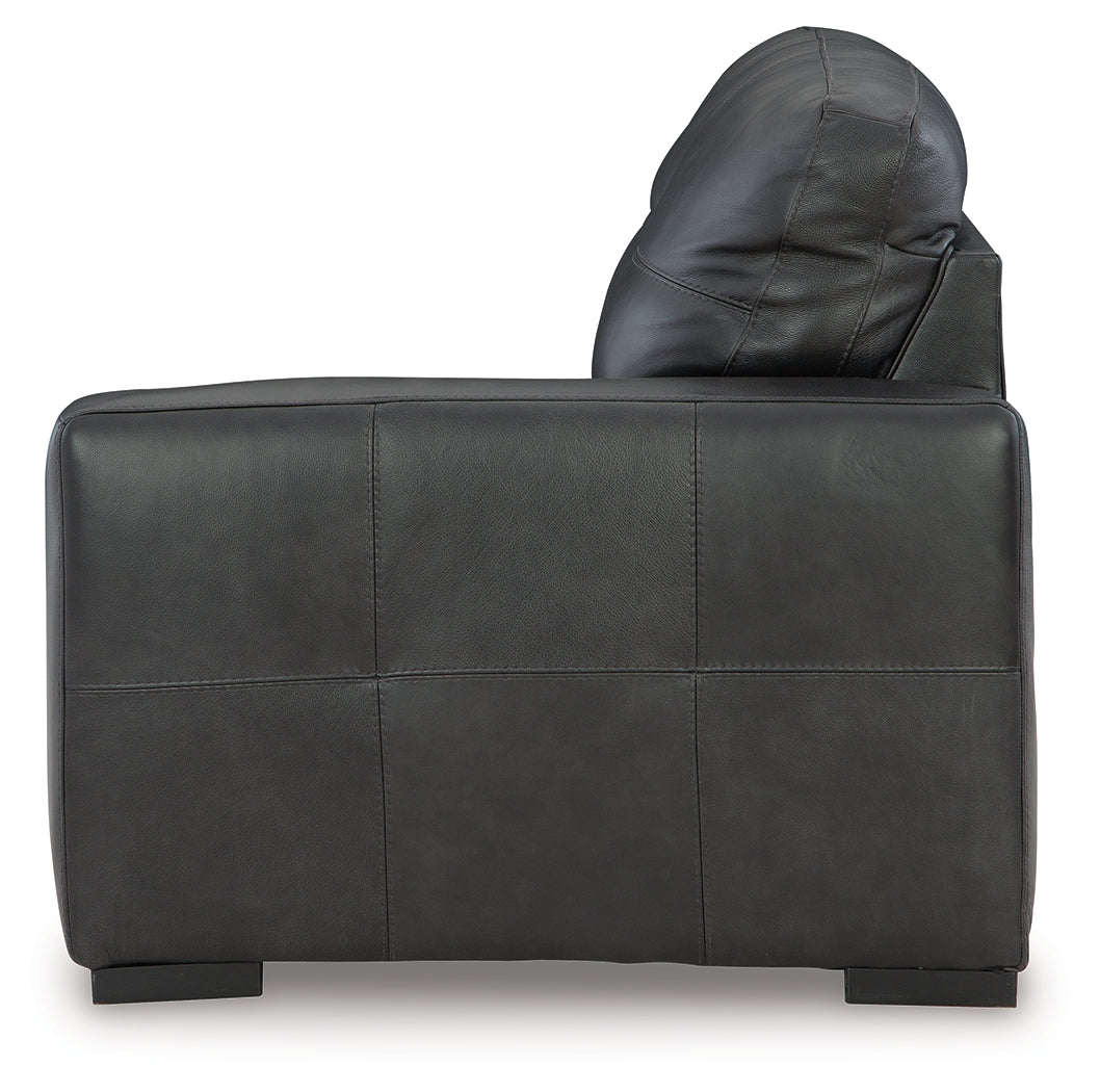 Room perspective of full sectional and ottoman set