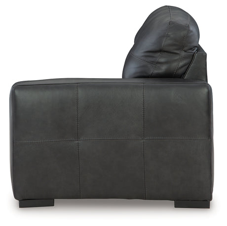 Room perspective of full sectional and ottoman set