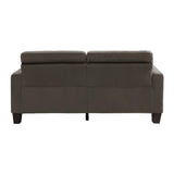Close-up detail of tufted chocolate fabric sofa