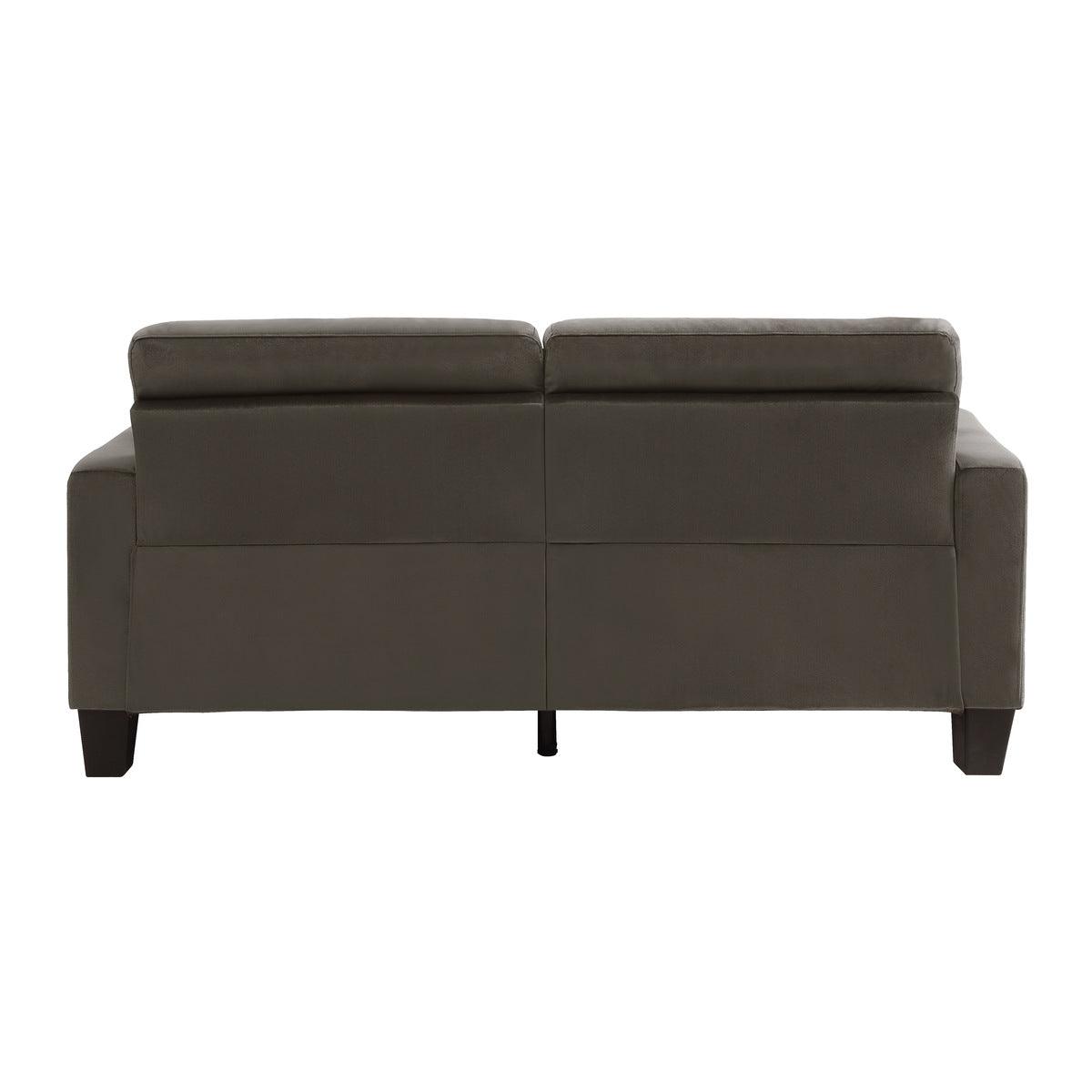 Close-up detail of tufted chocolate fabric sofa